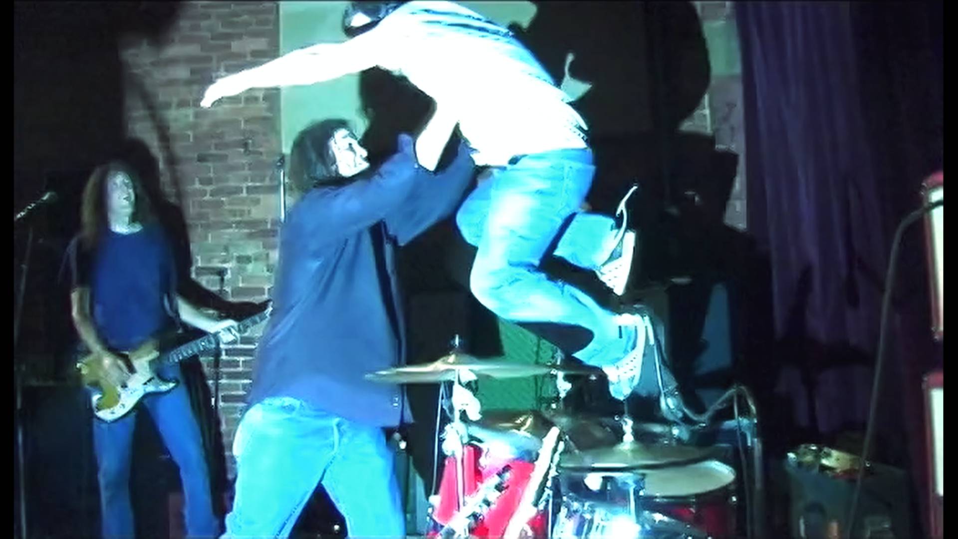 Tony Harper jumps Brent Best catches and Brian Lane looks on.