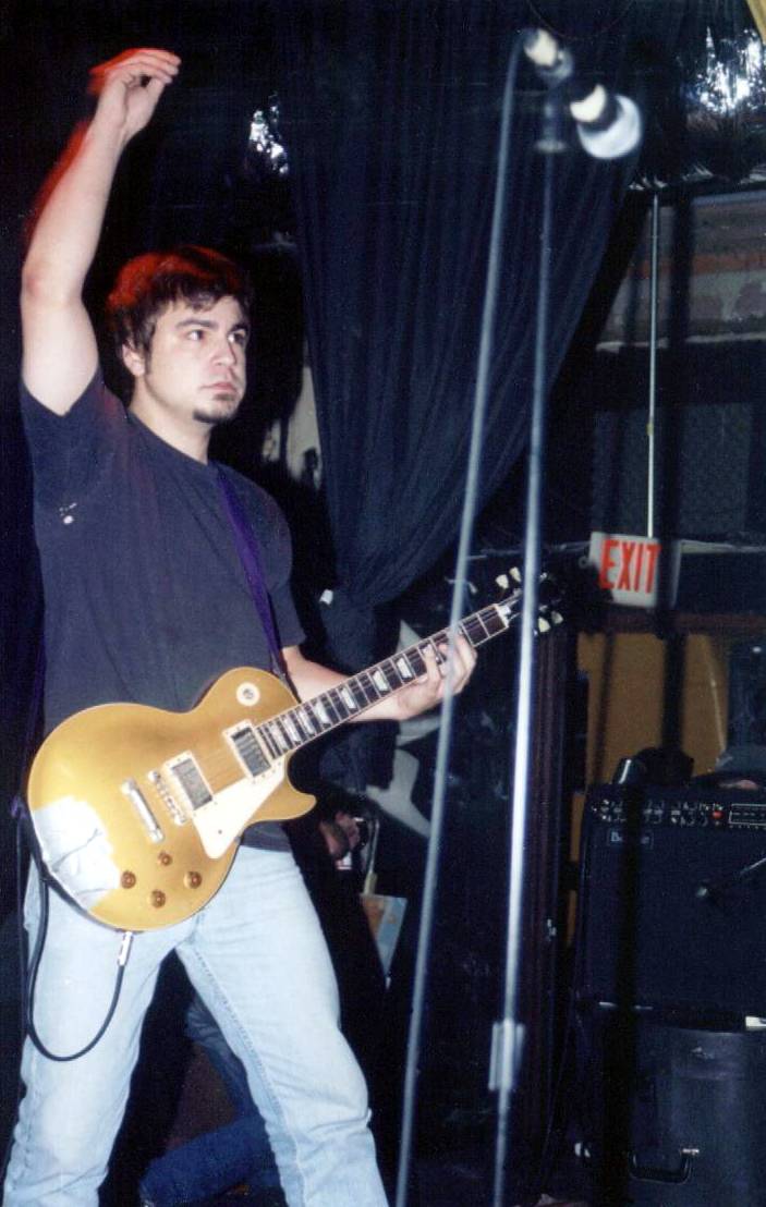 Jess Barr on the shiny gold guitar.