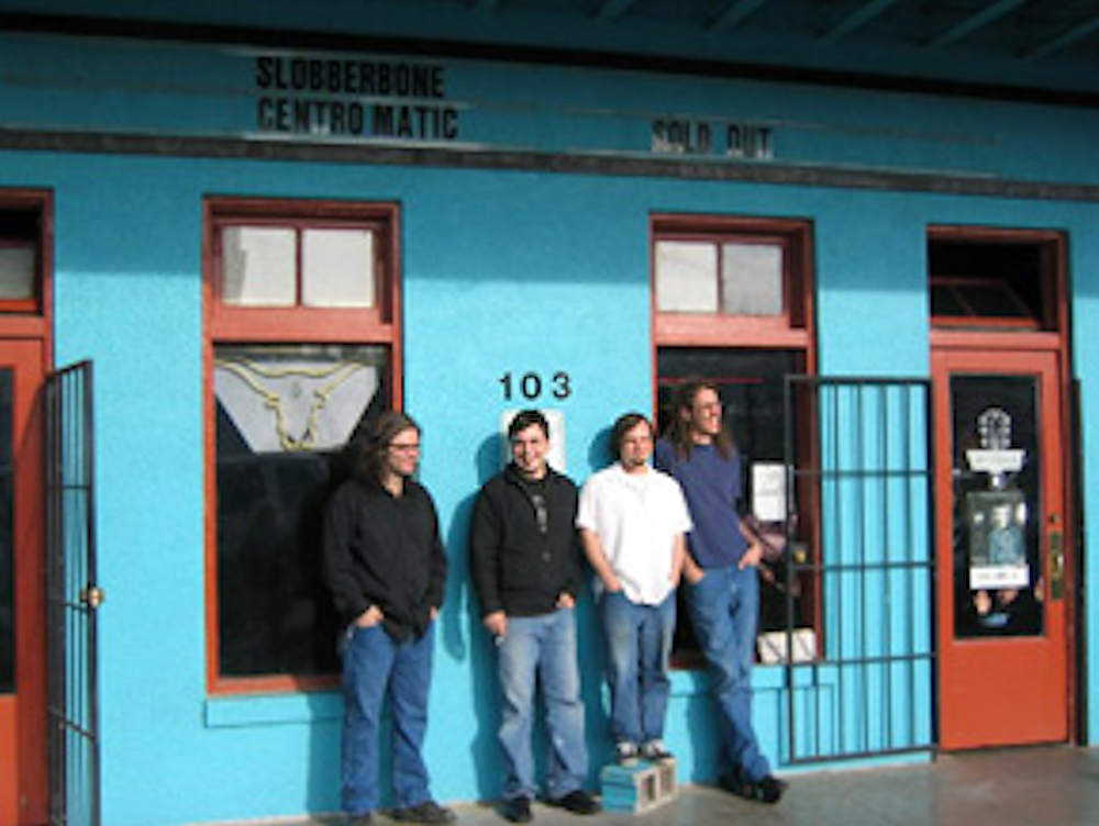 Brent Best, Jess Barr, Tony Harper, and Brian Lane pose in front of Dan's Silverleaf.